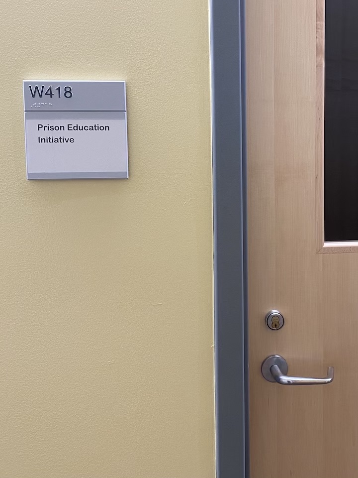 Picture of an office with a plaque reading Prison Education Initiative